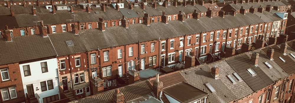 High angle view of terraced houses across some streets.